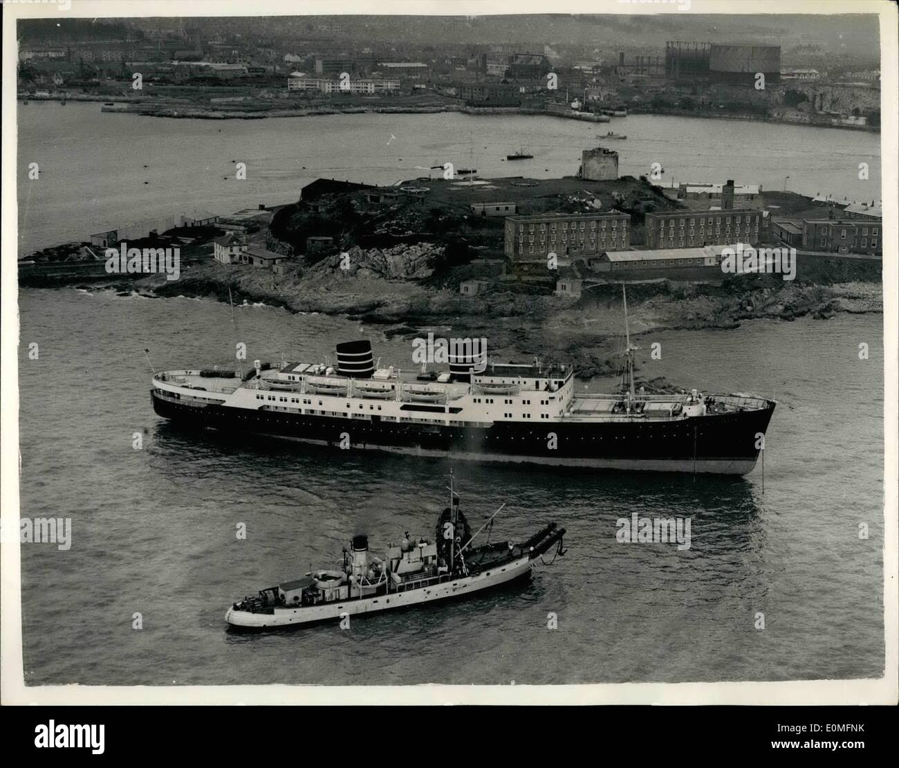 Mar. 03, 1955 - Norewegian Liner Aground off Plymouth Hoe.. As seen From the Air: Never before has a liner come so close to Plymouth Hoe.. So close, in fact, that the 6,269 ton ''Venus'' is on the rooks. Twice yesterday tugs tried to refloat her. This morning's attempt left ''Venus'' as seen in this picture from the air.. Five Thousand people watched as tuge tried again last night- the liner lifted but remained fast on the rocks.. Heavy gear and cargo is being removed he give her a better chance of being reflated at the next high tide. Stock Photo