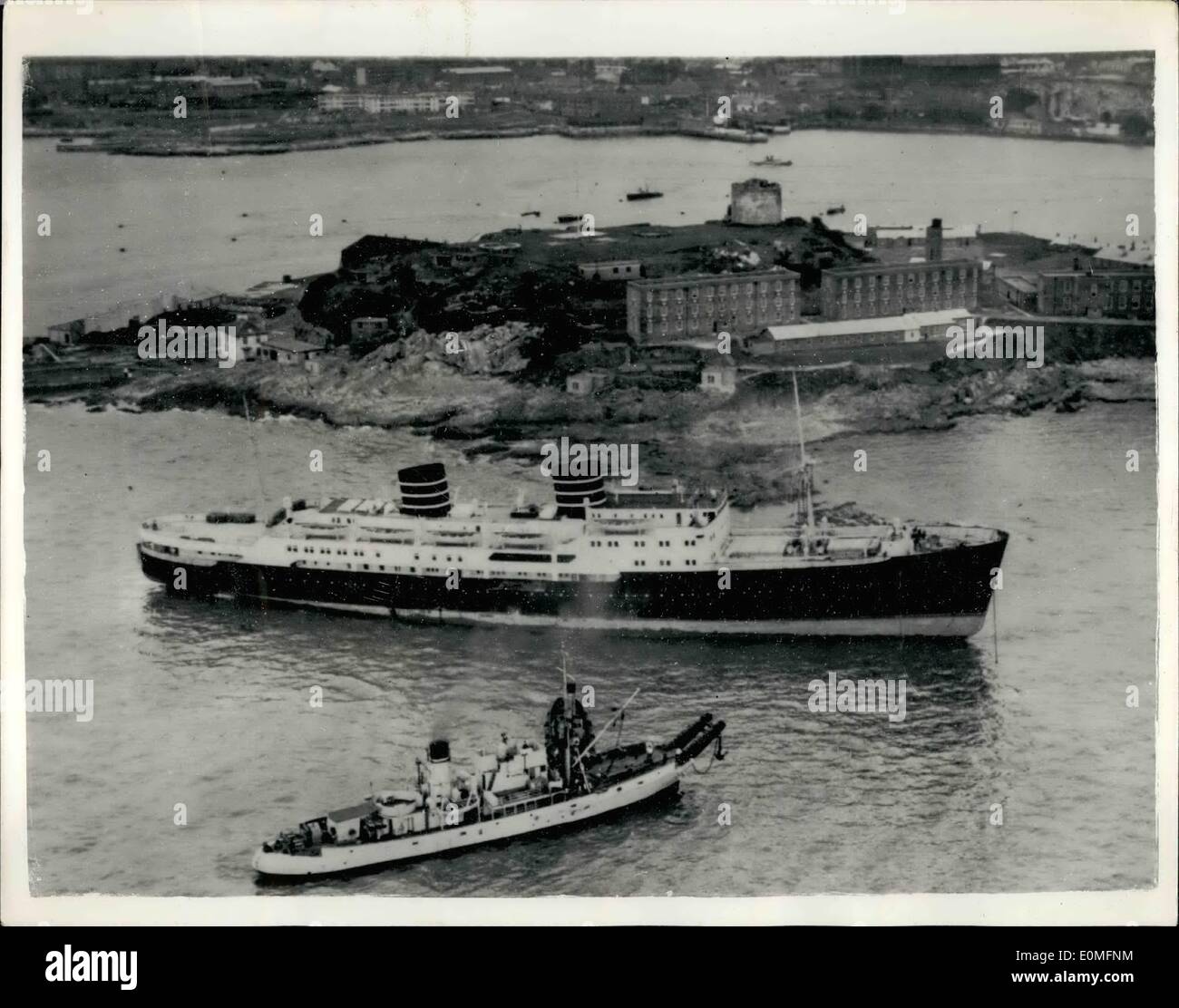 Mar. 03, 1955 - Norwegian Liner Aground Off Plymouth Hoe.. As Seen From The Air.. Never before has a liner come so close to Plymouth Hoe.. So close, in fact, that the 6,269 ton ''Venus'' is on the rocks. Twice yesterday tugs tried to refloat her. This morning's attempt left ''Venus'' as seen in this picture from the air.. Five thousand people watched as tugs tried again last night - the liner lifted but remained fast on the rocks.. Heavy gear and cargo is being removed to give her a better chance of being refloated at the next high tide. Stock Photo