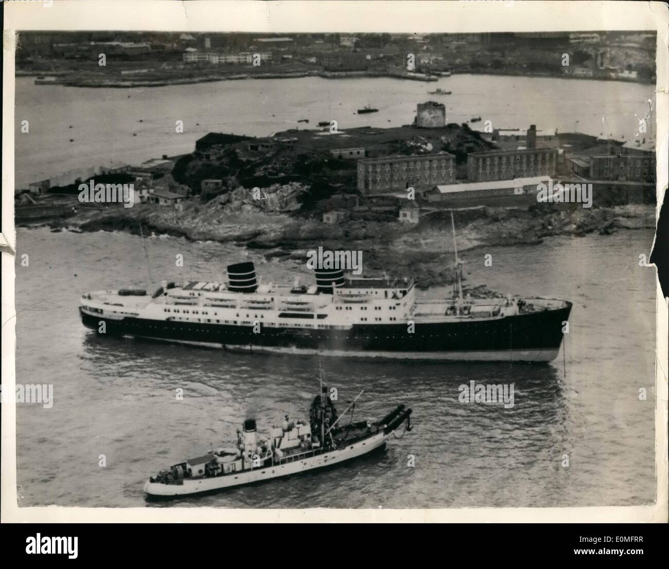 Mar. 03, 1955 - Norwegian Liner Aground Around Off Plymouth Hoe.. As seen from the Air: Never before has a liner come so close to Plymouth Hoe.. So close, in fact, that the 6,269 ton ''Venus'' is on the rocks. Twice yesterday tugs tried to re-float bar. This Morning's attempt left ''Venus'' as seen in this picture from the air... Five thousand people watched as tugs tried again last night- the linear lifted but remained fast on the rocks. Heavy gear and cargo is being removed to give her a better chance of being refloted at the next high tide. Stock Photo
