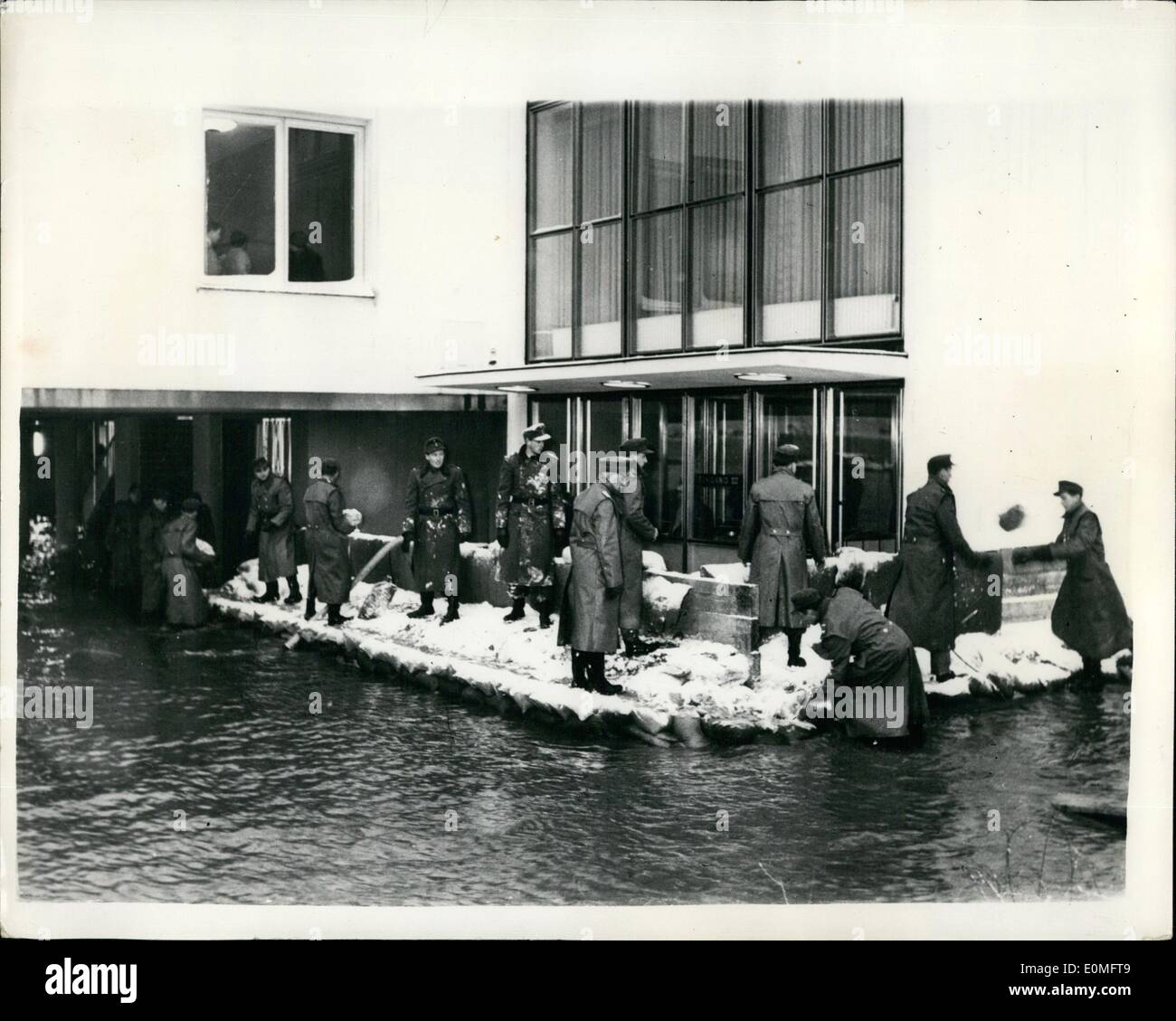 Jan. 01, 1955 - Parliament Building In Bonn - Surrounded By Floods Headquarters Of West German Government Threatened: Photo shows The scene at Bonn this morning - showing the West German Parliament Building surrounded by the ever rising flood waters - which new threaten to initiate thousands of miles of land throughout Europe. West German Police are seen trying to keep out the waters. Stock Photo
