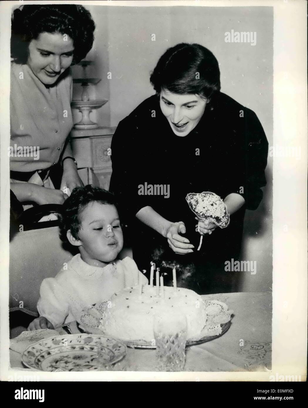Jan. 01, 1955 - Silvana Mangano gives birthday party for her eldest daughter; Silvana Mangano, the Italian film star, who is expecting a baby in February, gave a birthday party to her eldest daughter, Veronica, on her fifth birthday, at her home in Rome. The party was gay affair Veronica and her three year old sister Isabella, who invited their little friends. Silvana Mangano served all the children and helped Veronica to cut her birthday cake. Photo Shows Five year old Veronica, blows out the candles on her birthday cake watched by her celebrated mother and governess. Stock Photo