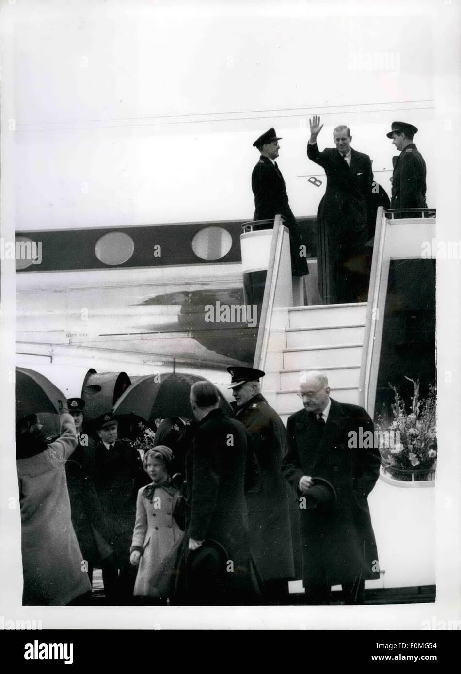 Jan. 01, 1955 - Duke of Edinburgh leaves on world tour wave farewell to each other.. H.M. The Queen with Princess Margaret and Princess Anne went to London Airport this morning to bud farewell to the Duke of Edinburgh who left on his world tour.. Traveling abroad a Comet IV airliner the Duke's first port of call is Delhi via Tripoli and Aden. Photo shows The Duke of Edinburgh waves from the aircraft - as H.M. the queen (bottom left) turne to wave back.. Princess Anne is in the bottom centre looking at her mother this morning. Stock Photo
