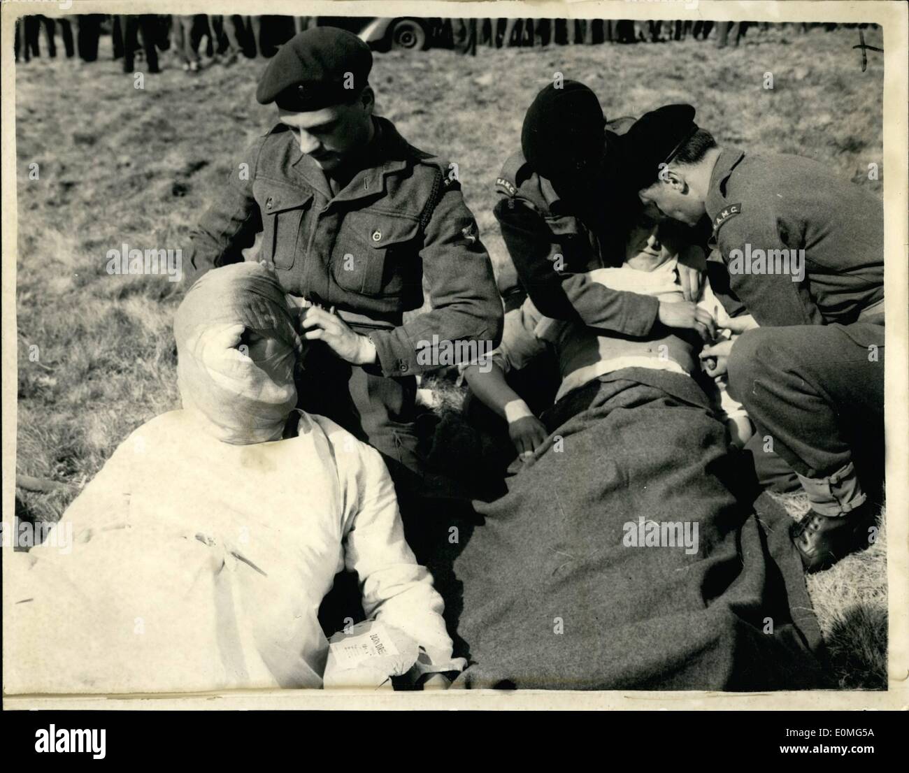 Apr. 04, 1955 - Army Officers Receive First Aid Instruction For Atomic Warfare: Withe the revolution in military strategy brought about by the development of atomic weapons more and more Army units are being trained in the first aid and rescue work that has hitherto been the province of Civil Defence. The first of these special first aid course for junior officers and senior N.C.O. a was held today at the Ewshot Camp, near Aldershot. On the completion of their course they will return to their as instructor in first aid, with special reference to atomic warfare Stock Photo