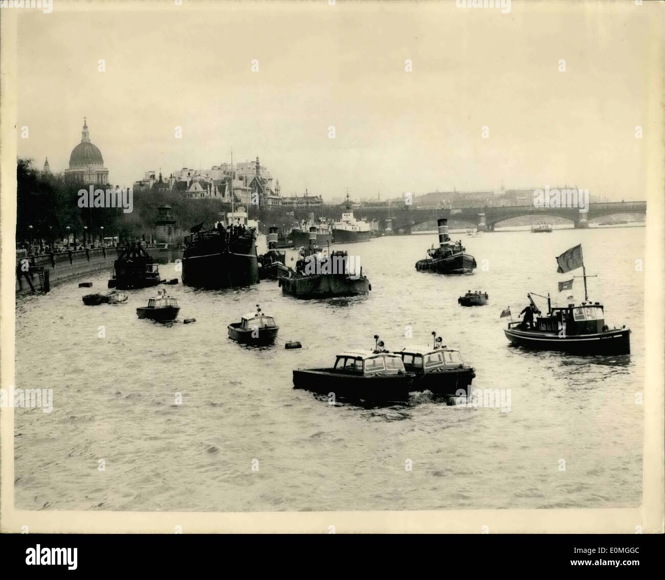 May 05, 1955 - The ''Discovery'' Returns To Victoria Embankment. Becomes A ''Floating Classroom'' For Ever: Captain Scott's ''Discovery'' - the famous vessels which took him on his first Antarctic Expedition returned to the Victoria Embankment this afternoon after an extensive refit in the London Graving Dock. She has been converted into a drill ship for London Division R.N.V.R. Photo Shows The ''Discovery'' being placed into position on the Embankment afternoon - showing St. Paul's in the background. Stock Photo