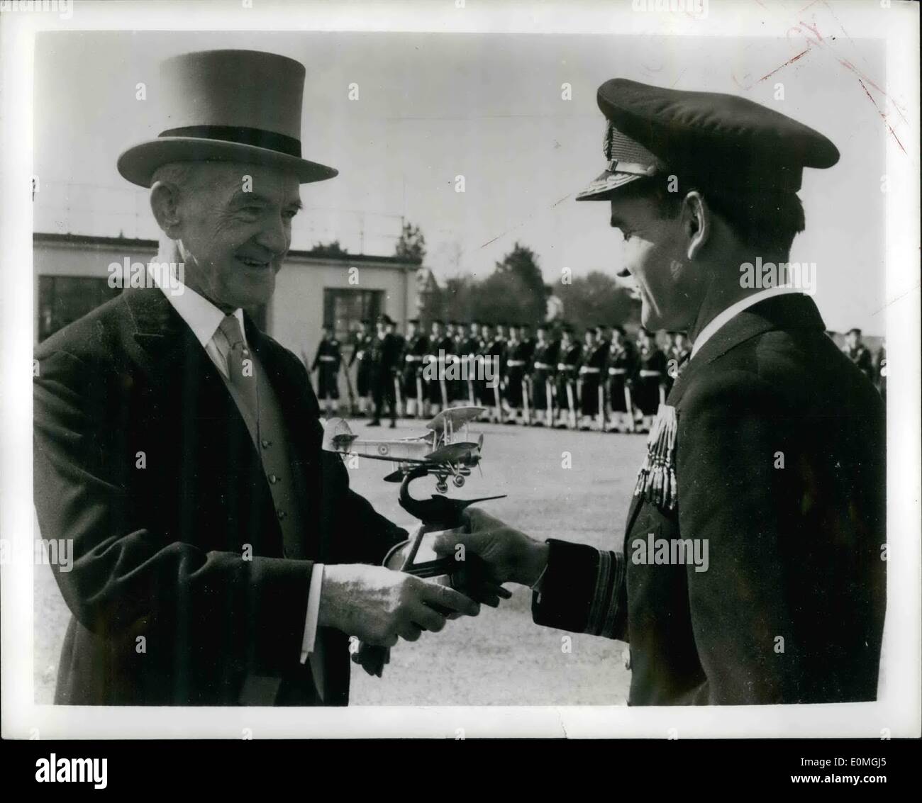 Apr. 04, 1955 - Wartime ace is award winning test pilot; The Boyd Trophy, awarded annually in Britain for the most outstanding feat in naval aviation, was presented this year to the Naval Test Squadron at the Airplane and Armament establishment at Boscome Down, England, for its contribution to the improvement of naval aircraft and the testing of new and undeveloped types. Photo Shows Admiral Sir Denis Boyd (left) presents the to Commander SG Orr of the Naval Test Squadron. During the war Commander Orr was a fighter pilot aboard the carrier ''Illustrious'' under Admiral Boyd's command Stock Photo