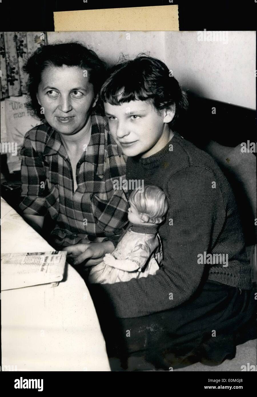 Apr. 04, 1955 - A sad Easter for German foster-mother: Erna Strobanak from Ebersberg, Munich, is afraid for her ''daughter'', twelf year old Claudia, Ten years ago she ''adopted'' the child who had to flee from the Russians. American judges now decided that the girl have to return for her right mother. Madame Georgette Cadi-Phelippeau, a French member of resistance who was dissolved from her daughter in a prison in Breslau. She is believing that Claudia was her daughter. Stock Photo