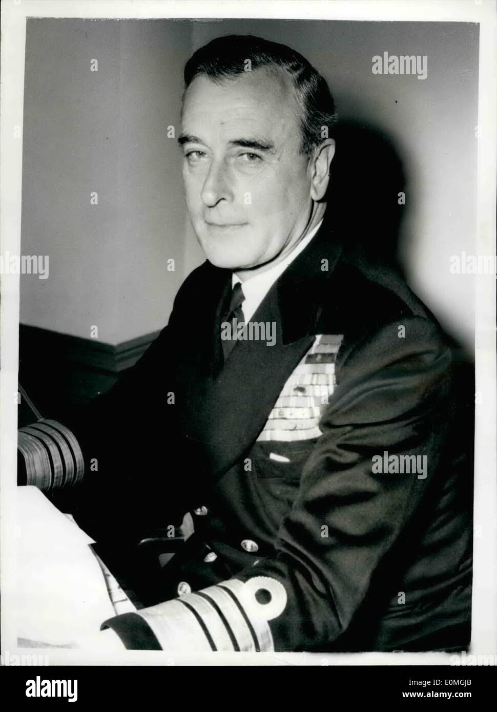 Apr. 04, 1955 - Earl Mountbatten Assumes His Duties As First Sea Lord: Earl Mountbatten, 57, a cousin of Queen Elizabeth II, and uncle of the Duke of Edinburgh, has assumed his duties as First Sea Lord. Until recently he commanded the British Mediterranean Fleet and the Mediterranean naval and air forces of North Atlantic Treaty organization countries. For the last month he has been making a round of inspections of naval bases and Admiralty departments in all parts of the country. Photo Shows: Admiral Earl Mountbatten of Burma, pictured in his room at the Admiralty this morning. Stock Photo