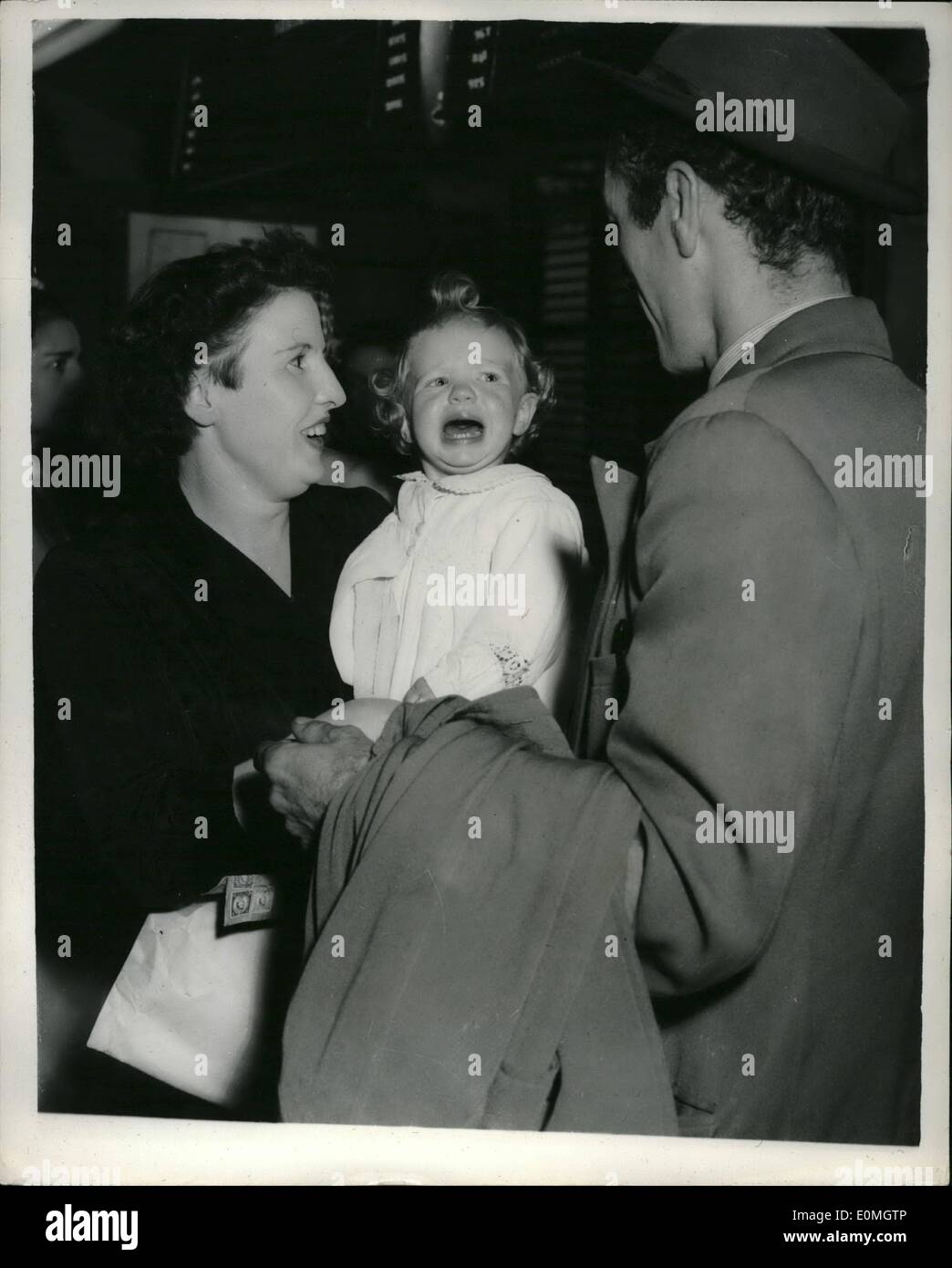 May 05, 1955 - MOTHER FLIES TO AMERICA TO GIVE HER BABY AWAY a 17 month old baby girl flew with her mother from London Airport last night to be adopted by an American couple she calls Mummy and Daddy. The baby is Joyce McDonagh,youngest of the six children of Thomas and Lily McDonagh,from Newton Le Willows, Lanca.Waiting for them at Holly Hill,South Carolina are Sergeant George Viansky of the US Air Force and his wife.The story started when Sergeant Viansky was stationed in Britain near the McDonaghs Stock Photo