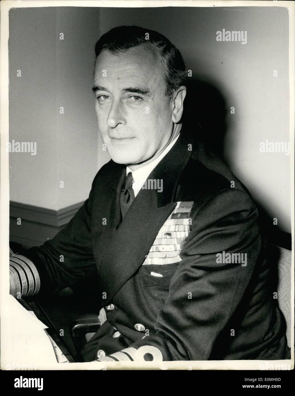 Apr. 04, 1955 - Earl Mountbatten Assumes his duties as First Sea Lord: Earl Mountbatten, 57, a cousin of Queen Elizabeth II, and uncle of the Duke of Edinburgh, has assumed his duties as First Sea Lord. Until recently he commanded the British Mediterranean Fleet and the Mediterranean naval and air forces of North Atlantic Treaty Organization Countries. For the last month he has been making a round of inspections of naval bases and Admiralty departments in all parts of the country. Photo Shows Admiral Earl Mountbatten of Burma, pictured in his room at the Admiralty this morning. Stock Photo