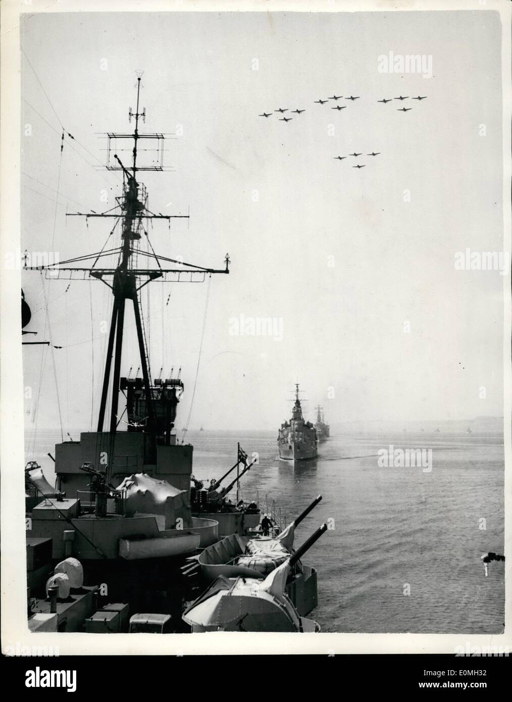 Jul. 07, 1955 - N.A.T.O. Ships Leave Forth On Exercise: Photo Shows Sixteen aircraft fly over the N.A.T.O. Ships as they sail out of the Firth of Forth, Scotland on Tuesday - for exercise. The picture, taken from H.M.S. Glasgow, shows H.M.S. Bermunds, followed by the Dutch cruiser De Ruyter - and flanked by destroyers. Stock Photo