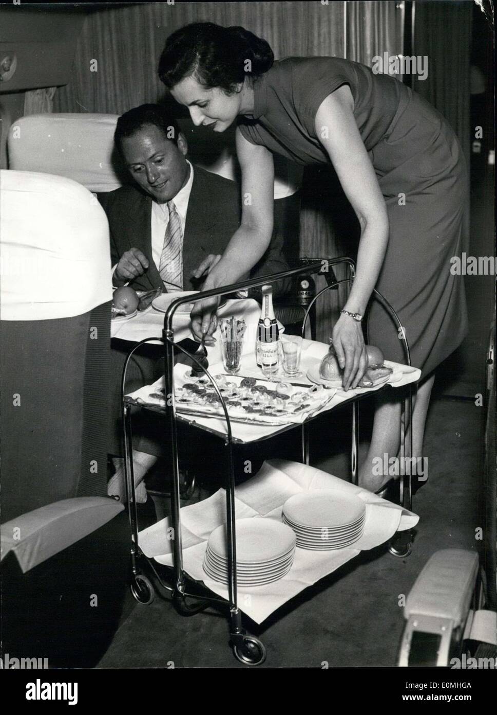 Jul. 29, 1955 - This stewardess is serving a man on a Lufthansa flight en route to New York from Germany. t Stock Photo