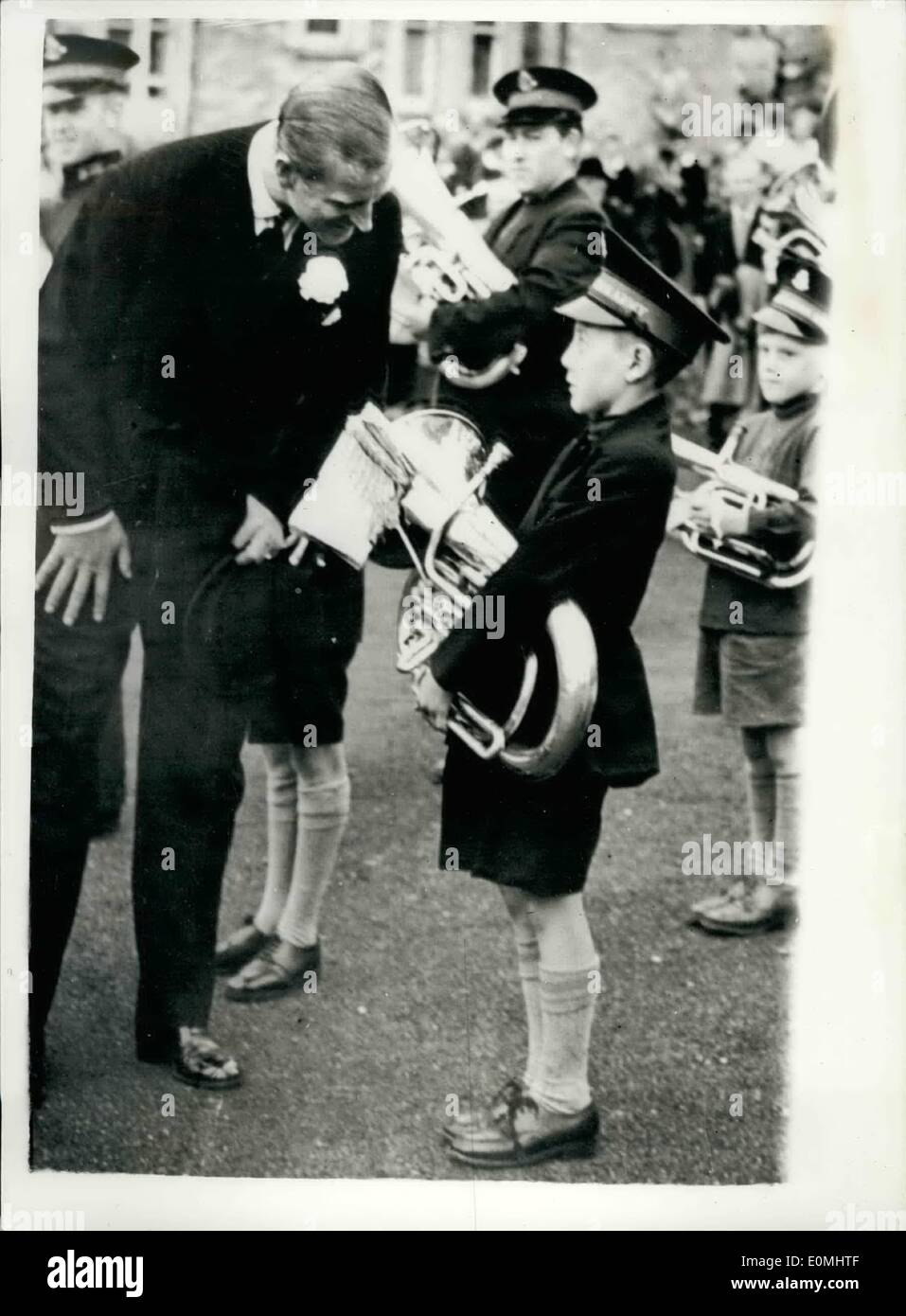 Aug. 08, 1955 - The Duke Chats to a young Euphonium Player. Royal visit to the isle of man: H.M. The Queen and the Duke of Edinburgh concluded their visit to the Isle of Man yesterday and started a cruise through the Western Isles to be followed by their holiday at Balmoral. The Duke is seen here as he stops to chat to 10 year old Charles Grigor a Salvation Army band boy - when the Royal party visited Peel, Isle of Man before leaving the island. Stock Photo