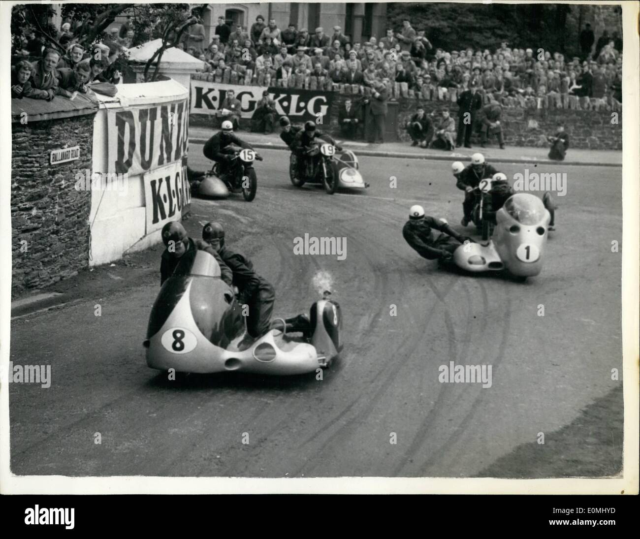 Jun. 06, 1955 - T.T. Races on the Isle of Man. Sidecar event: Photo shows general view showing competitors rounding Parkfield Corner start of the international sidecar event. during the T.T. on the Isle of Man. No.1 Wilhelm Noll of Germany. the world sidecar champion who was leading but who was crashed five miles from the finish. The event was won by Willi Schneider of Germany on a B.M.W. Stock Photo