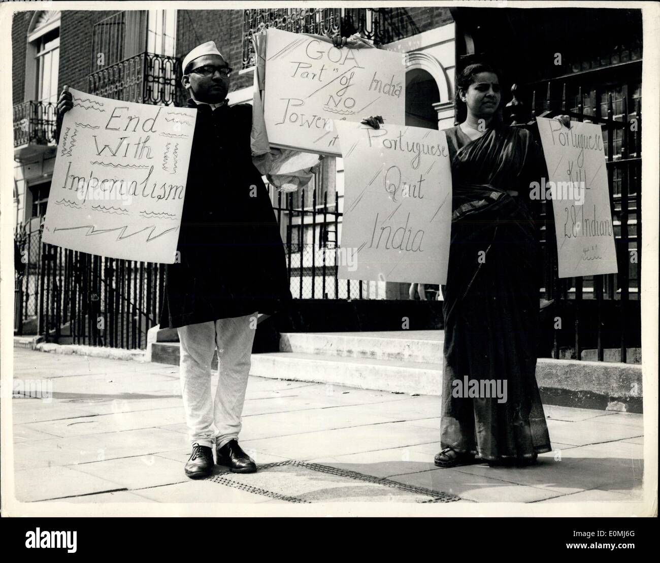 Aug. 17, 1955 - Indians Demonstrate Outside Portuguese Embassy: Students and others - Indian Nationals were to be seen outside the Portuguese Embassy in London this morning demonstrating against the recent clashes in GOA - the Portuguese territory in India. Some of the demonstrators are staging a hunger strike. Photo Shows: Mr. R.P. Vyas from Bombay - and Mrs. Gautam from Lucknow - in national dress - with their placards - outside the Embassy this morning. Stock Photo