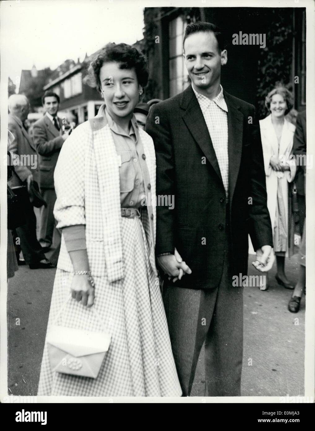 Jun. 06, 1955 - Arriving for opening of Wimbledon tournament. ''Little Mo'' and husband attend. Photo shows Maureen Connolly the champion who is not defending her title - arrives with her husband Mr. Norman Brinker - for the opening of the 1955 tournament at Wimbledon this afternoon . ''Little Mo'' is to report on the tournament Stock Photo