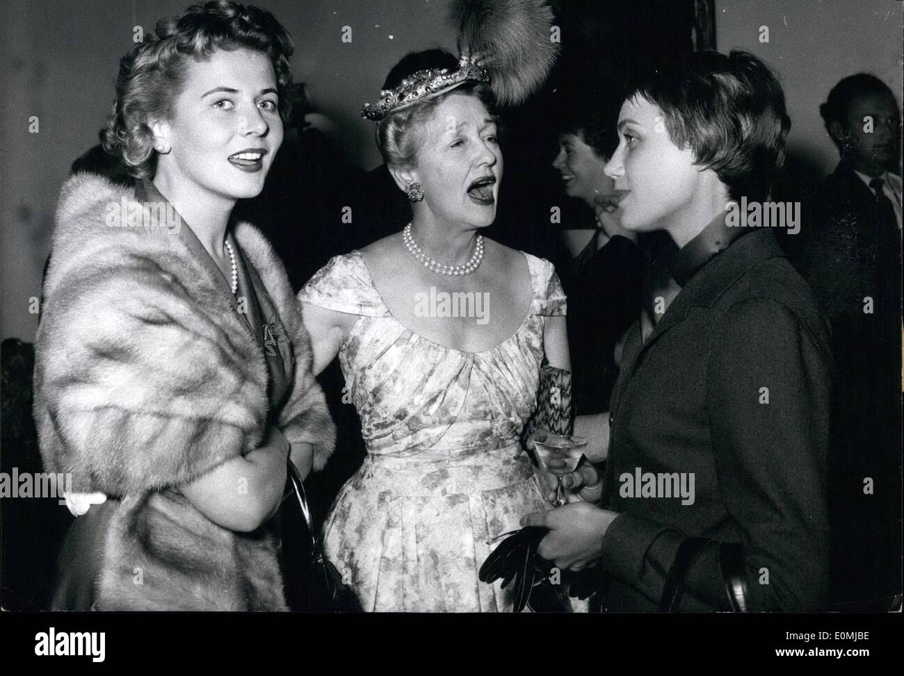 Jun. 06, 1955 - Hedda Hopper came from Hollywood to Munich... to visit some friends. OPS: Cornell Borchers (left) Hedda Hopper and Anneliese Friedmann-Schuller. Mrs Hedda Hopper showed them her hats. Stock Photo