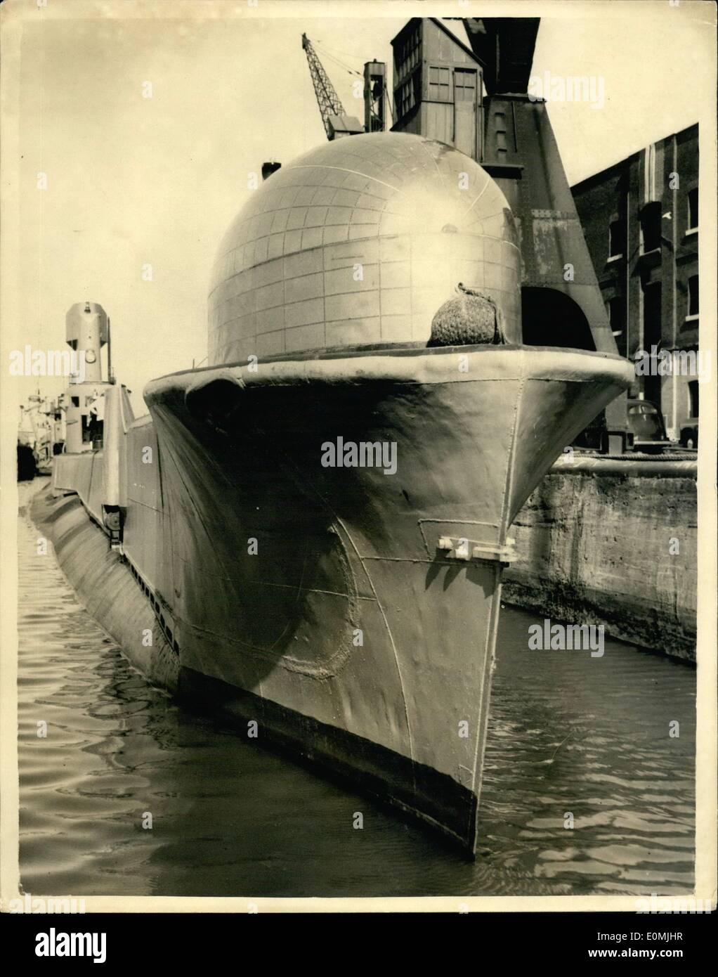 Jun. 06, 1955 - The R.N. Experimental Submarine comes to London Strange Dome on the Bows. H.N.E. Thermopylae commanded by Lieut. Commander W.D. Scott R.N. is now on a visit to London and was to be seen at the East India Dock this afternoon. She was built at Chatham in 1945 and has been moderniedlengthened and is now used mainly for experimental purposes. She has been streamlined and has also been fitted with a strange looking dome on the bows. Photo shows head on view of the craft at the East India Docks this afternoon - showing the unusual looking dome on her bows. Stock Photo