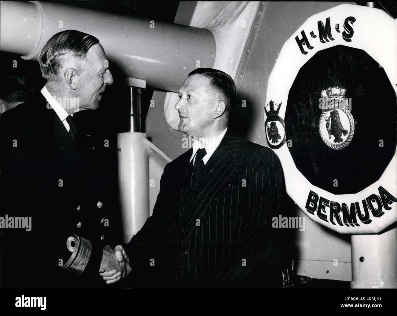 Jun. 06, 1955 - Gesture of Cooperating during the Kieler Woche The former German Oberstleutnant Gustav Zuschneid was welcomed by Rear-Admiral Richard G. Onslow on board of HMS Bermuda anchored at Kiel during the Kieler Woche. These days Zuschneid sent back to England the Union Jack, which had been hauled in by the Germans as they entered Paris in World War II at a British soldier's cemetery near Versailles. OPS: Admiral Onslow (L) and Herr Zuschneid. Stock Photo