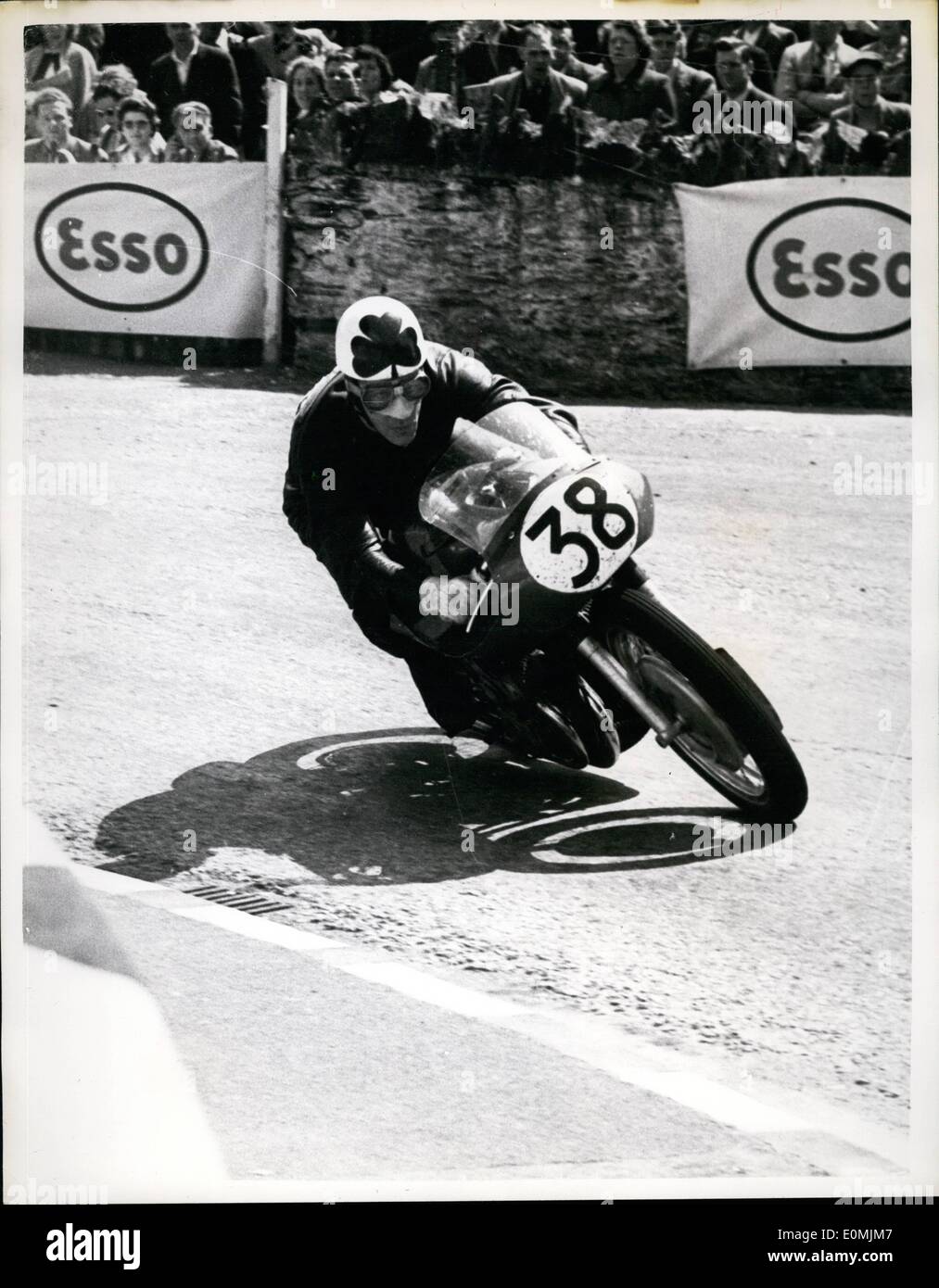 Jun. 13, 1955 - 13-6-55 Reg Armstrong takes second place in Senior T.T. on the Isle of Man. Keystone Photo Shows: Reg. Armstrong of Dublin at speed at Quarter Bridge when he took second place in the Senior T.T. on the Isle of Man. His speed was 96.74 m.p.h. on a Gilera. The event was won by Geoff Duke at the record speed of 97.93 m.p.h. Stock Photo
