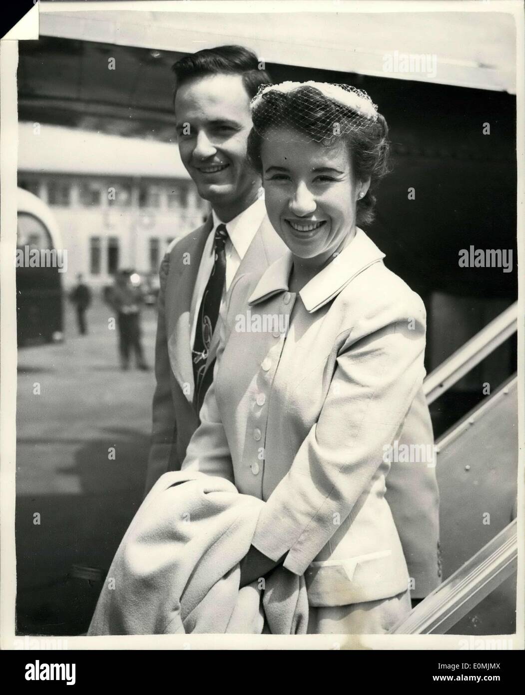 Jun. 17, 1955 - Maureen Connolly Arrives In London On Honeymoon: Maureen Connolly the young American World Tennis Champion-and her husband of four dauys-Norman Brinker-American Olympic Horseman arrived at London report on the Wimbledon Championships. She is not defending her title. Photo shows. Maureen Connolly and husband Norman Brinker walk away from the aircraft hand-in-hand on their arrival at London Airport this morning. Stock Photo