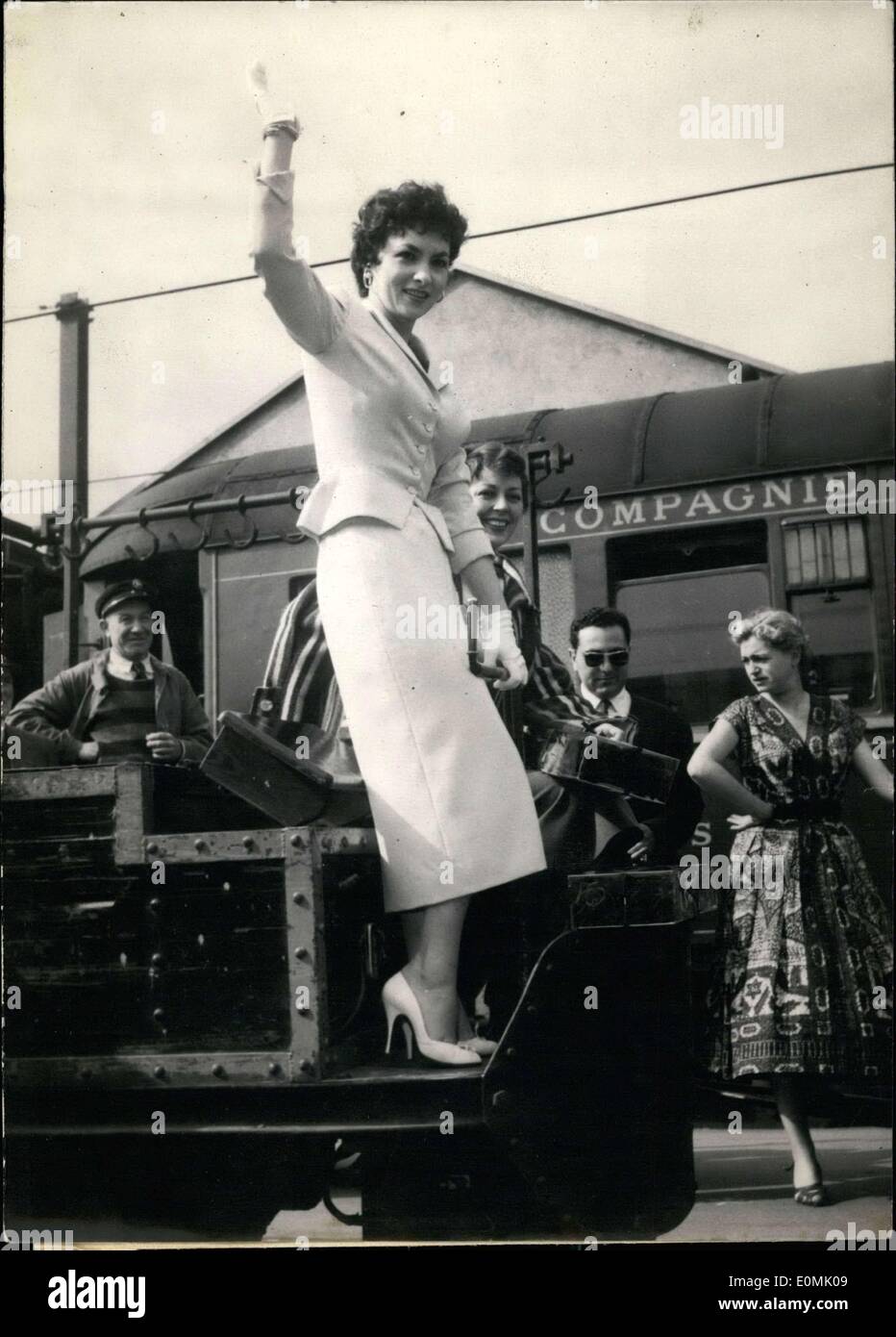 Jun. 30, 1955 - The beautiful Italian star, Gina Lollobrigida, arrived this morning at the Lyon Train Station. She will be shooting her next film in France with Anne Vernon. Here she is on top of a wagon at the station waving to admirers with Anne Vernon behind her. Stock Photo