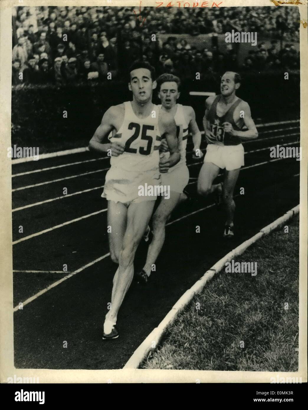 Sep. 17, 1955 - 17 -9-55 Emil Zatopek beats Gordon Pirie by half a lap. Athletic meeting in Prague. Czechoslovakia's Emil Zatopek beat Britain's Gordon Pirie by 200 yards in the 10,000 meters event in the Britain versus Czechoslovakia games in Prague. Keystone Photo Shows: Scene during the great race in Prague, showing Gordon Pirie, Sando and Emil Zatopek. The latter won by 200 yards. Stock Photo