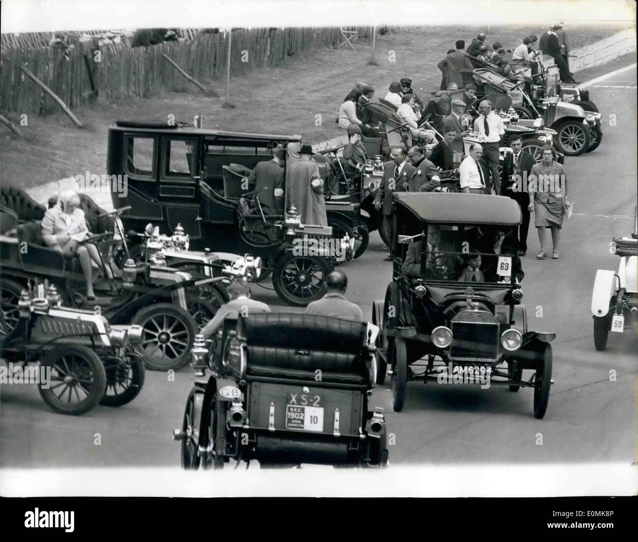Jul. 07, 1955 - Veteran Car Rally At Crystal Place: A magnificent array of some of the earliest motor vehicles, assembled yesterday at Crystal Palace, during the London Veteran car rally. Photo Shows A 1915 (No. 69), driven by A. Macintosh, of Buckingham, Kent, passing a 1902 (No.10) Arrol-Johnstone, driven by N.R. Cole, in front of some of the veteran cars at yesterday's rally. Stock Photo