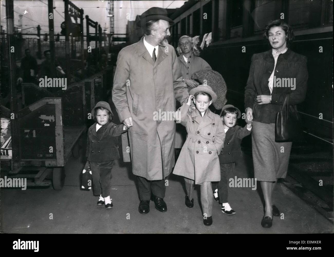 Oct. 10, 1955 - Ingrid Bergman Arrives In Paris - Nurse, Friend Ad Children: Ingrid Bergman with her children Ingrid, Roberto and Isabelle, accompanied by a friend (unidentified) and followed by the nurse as she alighted from the orient express coming from Rome this morning. She is to star a new film produced by Jean Renoir ''Oeillet Rouge'' (Red Carnation) based on the story of general Boulanger's life. Stock Photo