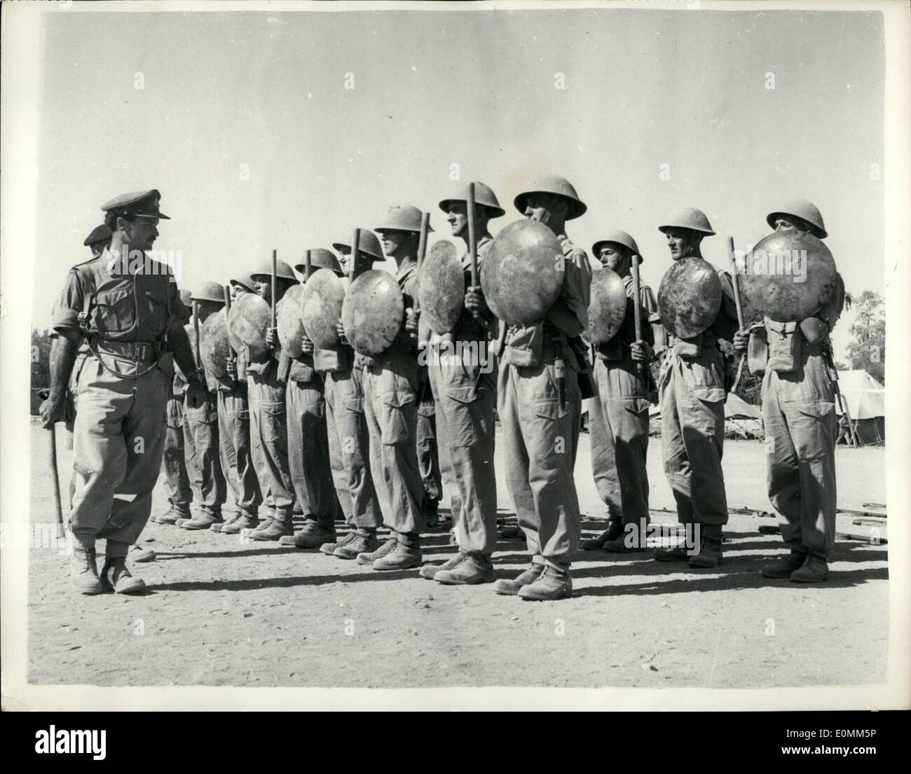 Oct. 10, 1955 - British troops in Cyprus Issd with Batons and Shields - replacing their rifles as anti-riot weapons.: Following the statement by the Governor of Cyprus-field Marshal Sir John Hardin - the british troops - 1st. battalion South Stafford regiment have been issued with metal shields (dustbin lids) and batons with which to quell riots. This is the first time in the history of the British Army that Tommy Atkins has to lay down his eifle and bayonet for a stick and a dustbin lid. Photo shows men of the South Stafford regt Stock Photo