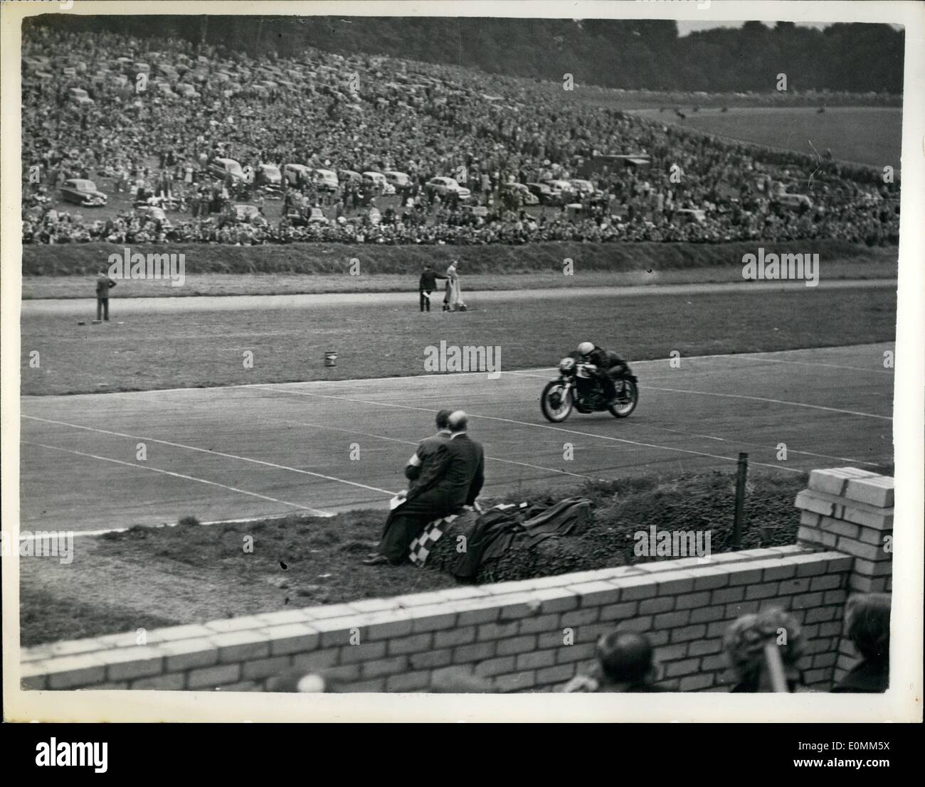 Oct. 10, 1955 - 60,000 Cheer Wonder Boy Of Motor-Cycling As He Beats World Champion Geoff Duke: It was a battle of giants and a Stock Photo