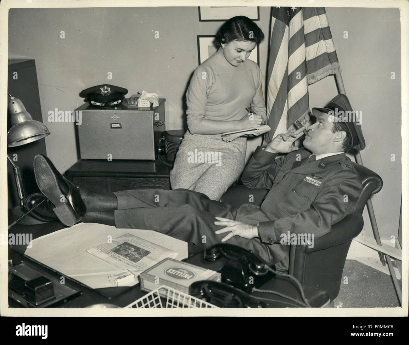 Dec. 12, 1955 - Bob Hope - Filming at Pinewood..''Not for Money'': Popular comedian Bob Hope in his role of an United States Air Forece Officer - dictates to Dorothy Livingstone - at Pinewood Studios - where he is making the new film ''Not for Money''..Bob says that parts of the new film call for scenes in Moscow - and he is hoping to obtain permission from the Soviet to visit that City to make the film shots. Stock Photo