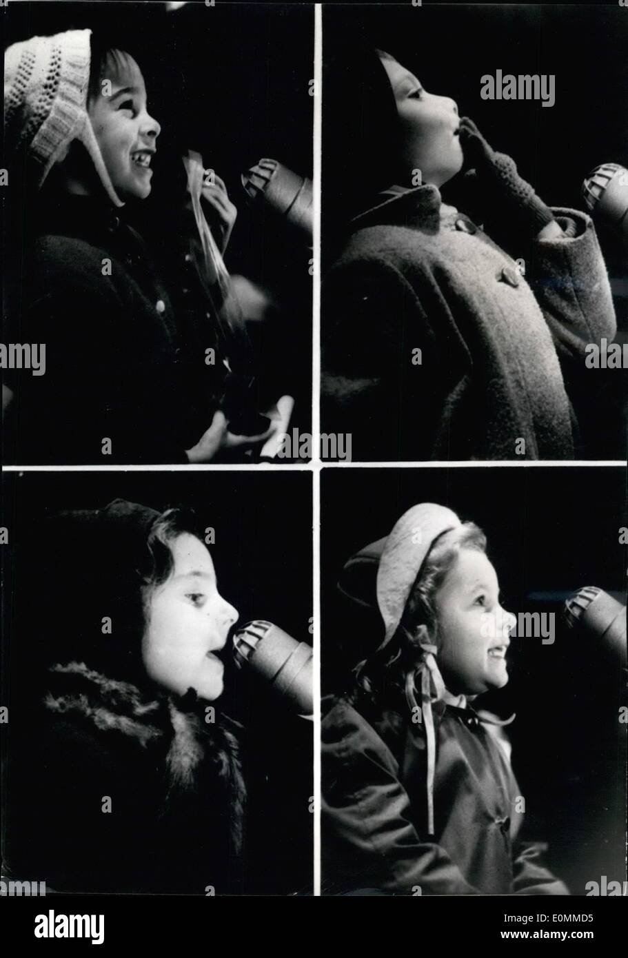 Dec. 12, 1955 - Hello Santa Claus: In our Epoch where the TV reigns on everything, the classical letter to Santa Claus seems quite obsolete. A General store in Paris just celebrated a new system: Through a microphone the kids talk directly to a Santa Claus they can see on a television screen. Our photographer caught different expression of wondered kids: From Satisfaction of admiration through bewilderment and whispered confidence. Stock Photo
