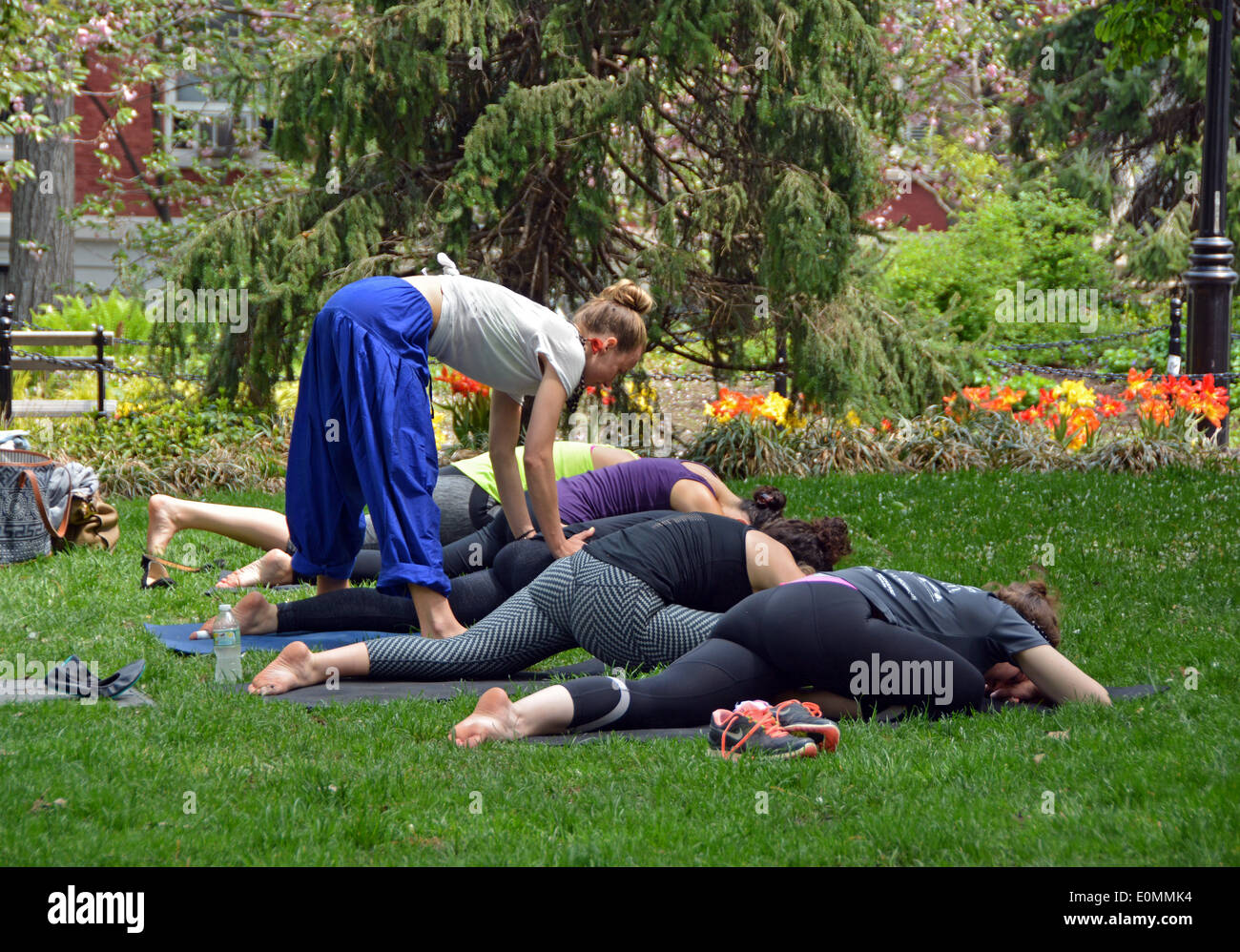 A women's outdoor yoga class in Washington Square Park in Greenwich Village, New York Stock Photo