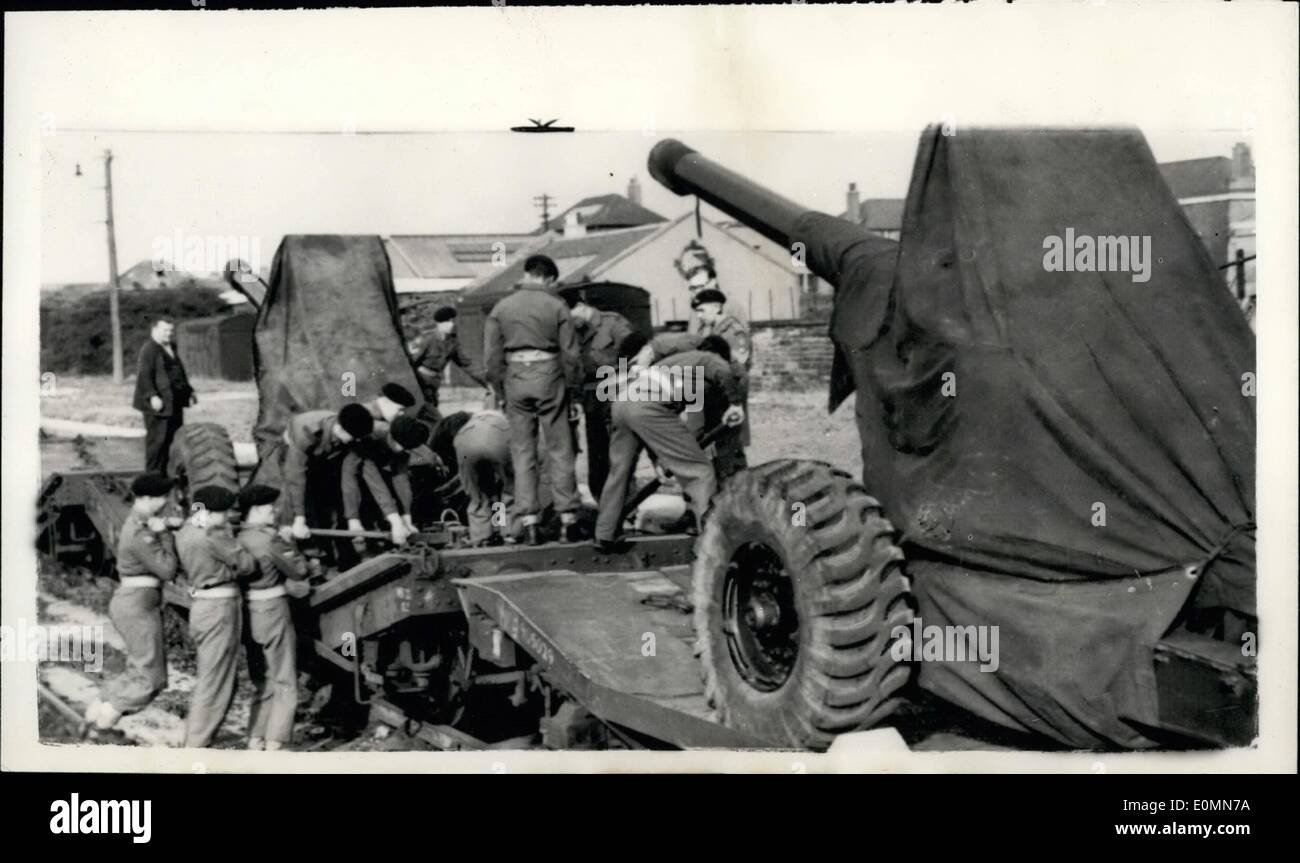 Mar. 03, 1956 - ''Operation Suez'' Begins... Loading Field Guns On To Rail Carriers... Many units of the Army have had their orders - following the 'Grab' of the Suez Canal by Colonel Nasser the Egyptian Prime Minister... Call up orders are expected to be issued within the next 36 hours to more than 25,000 reservists - mostly army - so that they will be ready to protect the canal in case of difficulty... Keystone Photo Shows: Men of the 21st. Medium Regiment, Royal Artillery, in Edinburgh busily at work loading Field Guns on to rail carriers - ready for Suez. Stock Photo