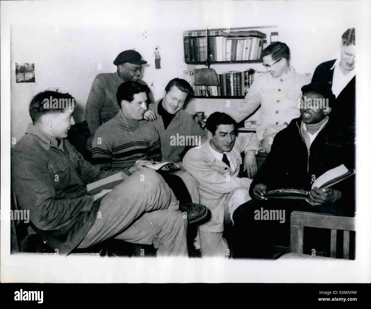 Jan. 01, 1956 - Former American Soldiers and a Scotsman gather in quarters at peiping people's University. From left seated: Morris Wills, Fort Ann, N.Y.; Harold Webb, Jacks Onville, Fla.; Andrew Condon, Scotland; Richard Corden, East Providence, R.I.; and William White, Plumervile, Ark. Standing from left: Clarence Adams, Memphis, Tenn,; John Dunn, Baltimore, MD.; and partly visible far right, Andrew Fortuna, Ionia, MItch. Stock Photo