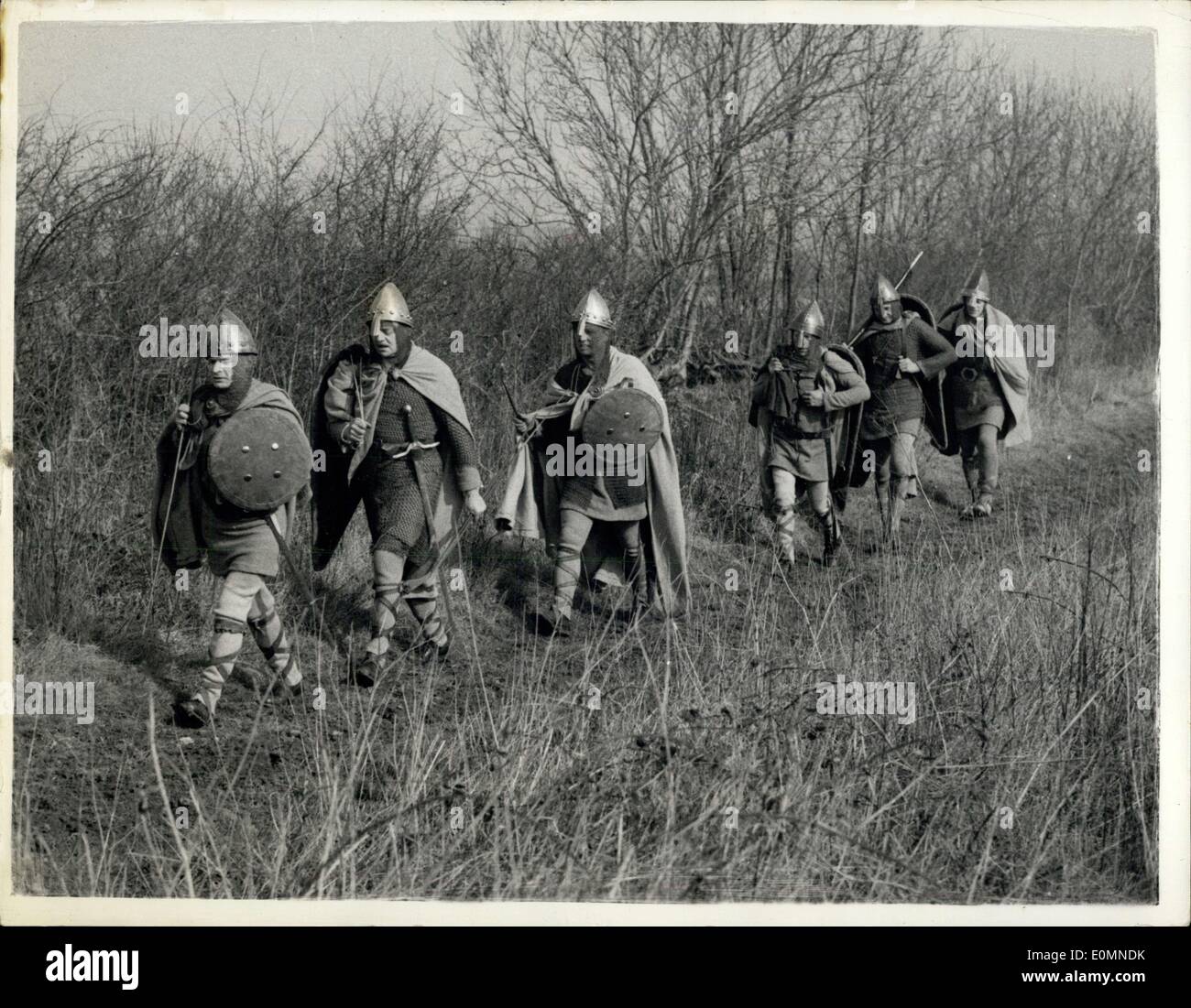 Mar. 11, 1956 - Back To 1066 - And All That. Marching Along A Roman Road.: Seven members of the Surrey Walking Club this morning were to be seen - dressed in Battle of Hastings Armour - marching along Posse Way - an ancient Roman Road between B th and Cirencester. It is an experiment to show whether in October 1066 Harold and his men could have marched 200 miles in ten days. The march is being filmed for the B.B.C. Television programme ''Up To Date'' to be shown in June Stock Photo