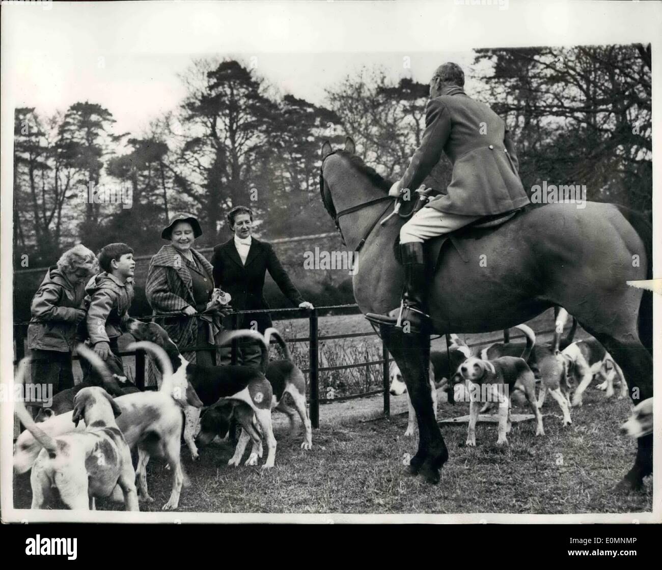 Jan. 13, 1956 - 13-1-56 Royal visit to the Norfolk Hunt. Prince Charles and Princess Anne meet the hounds. Queen Elizabeth, the Queen Mother, drove from Sandringham with Prince Charles and Princess Anne, to watch the meet of the West Norfolk Hunt at Harpley Dams yesterday. The two children made friends with many of the hounds. Photo Shows: The Queen Mother, with Prince Charles and Princess Anne, talking to the Master of the West Norfolk Hunt, Major Robert Hoare at the meet yesterday. Stock Photo