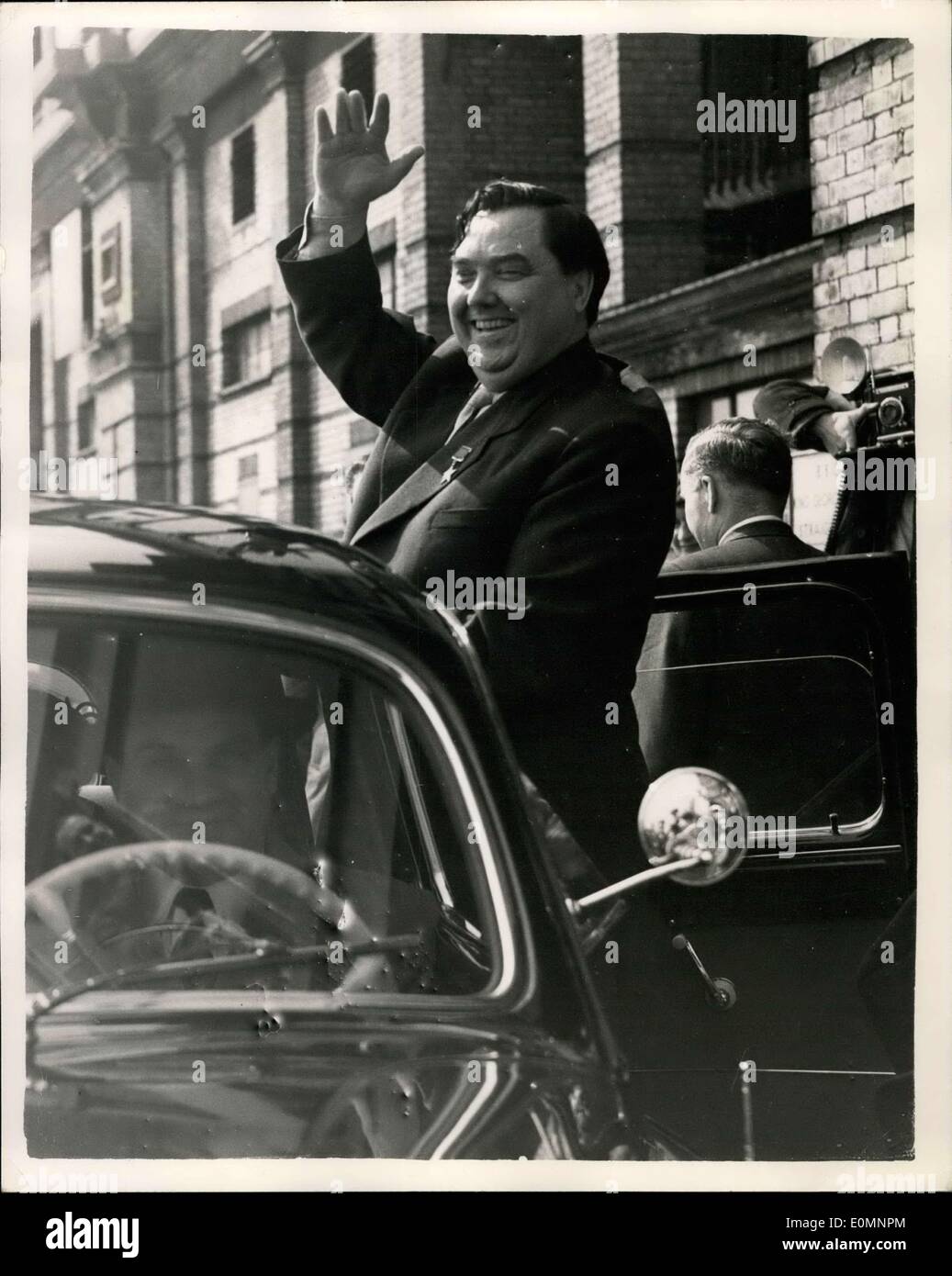 Apr. 02, 1956 - Malenkov visits the B.B.C Studios at Alexandra Palace: Mr. Malenkov today paid a visit to the B.B.C studios at Alexandra Palace to see a film of his 1,700 miles round Britain tour. Photo shows Mr. Malenkov stands on the running board of his car and waves to the crowd as he leaves the studios today. Stock Photo