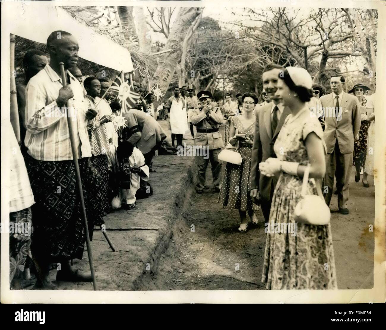 Feb. 02, 1956 - ROYAL NIGERIAN TOUN. QUEEN AND DUKE VISIT LEPER COLONY PHOTO SHOWS:- H.M. THE QUEEN Smilingly listens to a speech made by a blind leper-during the Royal visit to the Oji River Settlement - a Nigerian Leper Colony. Stock Photo