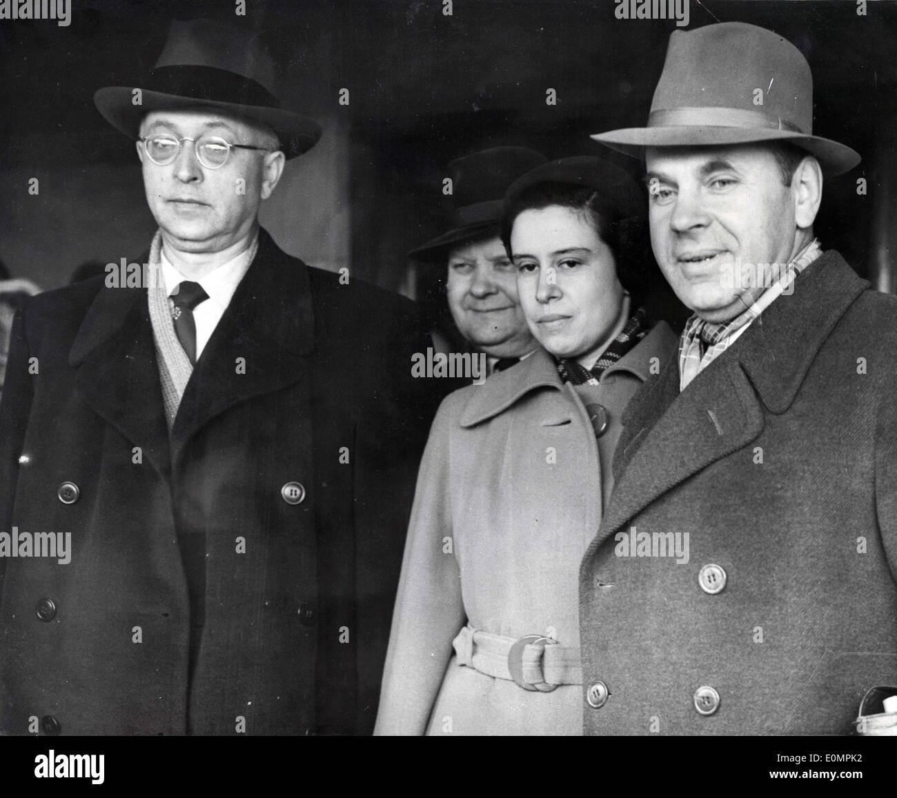 Apr 16, 1956 - London, England, United Kingdom - MR. KUMYKIN, MISS TUPOLEV and NIKOLAI MIKHAILOV arrive at London Airport for a Stock Photo