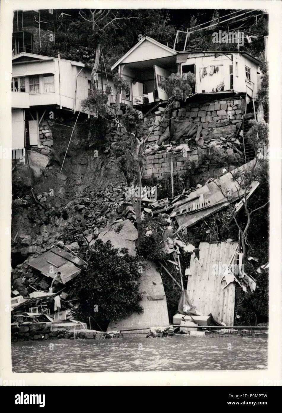 Feb. 18, 1956 - Flood waters undermine house foundations at Seaforth, new South Wales buildings crash in harbour; Photo Shows View of the wreckage after flood waters had undermined the rock foundations of houses which crashed into the harbour at Seaforth Crescent, Seaforth, New South Wales during the recent floods which are sweeping across large areas of Australia. Only one man is believed to have lost his life in this incident but the flood damage is thought to have run into millions. Stock Photo