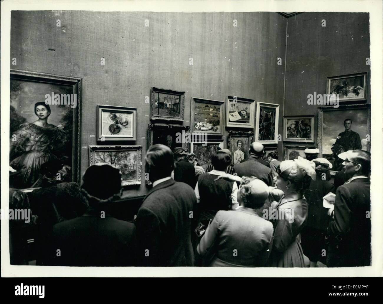 May 05, 1956 - Private view day - Royal Academy. Model of new office Block on show : Photographs were allowed at the Private view of the Royal academy summer Exhibition today for the first time. Photo shows Visitors looking at (right) Portrait of the Duke of Edinburgh by Anna Zinkeisen with on left the paining of Margot Font eye by Annigoni - at Burlington House today. Stock Photo