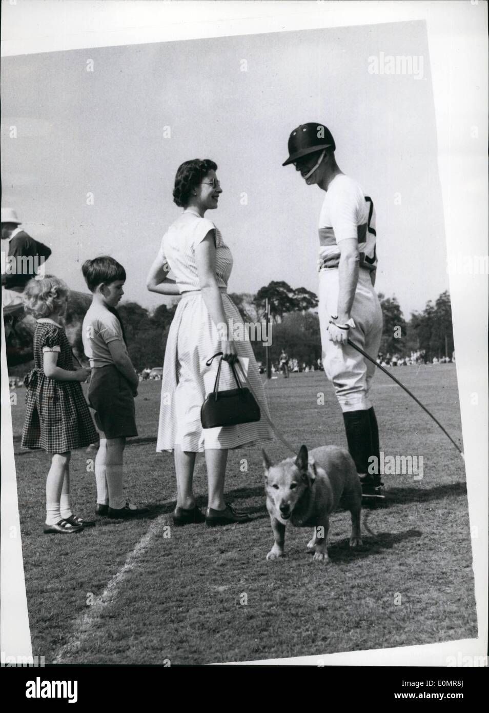 May 05, 1956 - Duke of Edinburgh plays Polo.. Queen and Children attend. The Duke of Edinburgh played Polo on Smith's Lawn in Windsor Great Park. The Queen and the two Royal children watched the game. Keystone Photo Shows:- The Queen goes over to chat to the Duke between Chukkers accompanied by Prince Charles and Princess Anne. Stock Photo