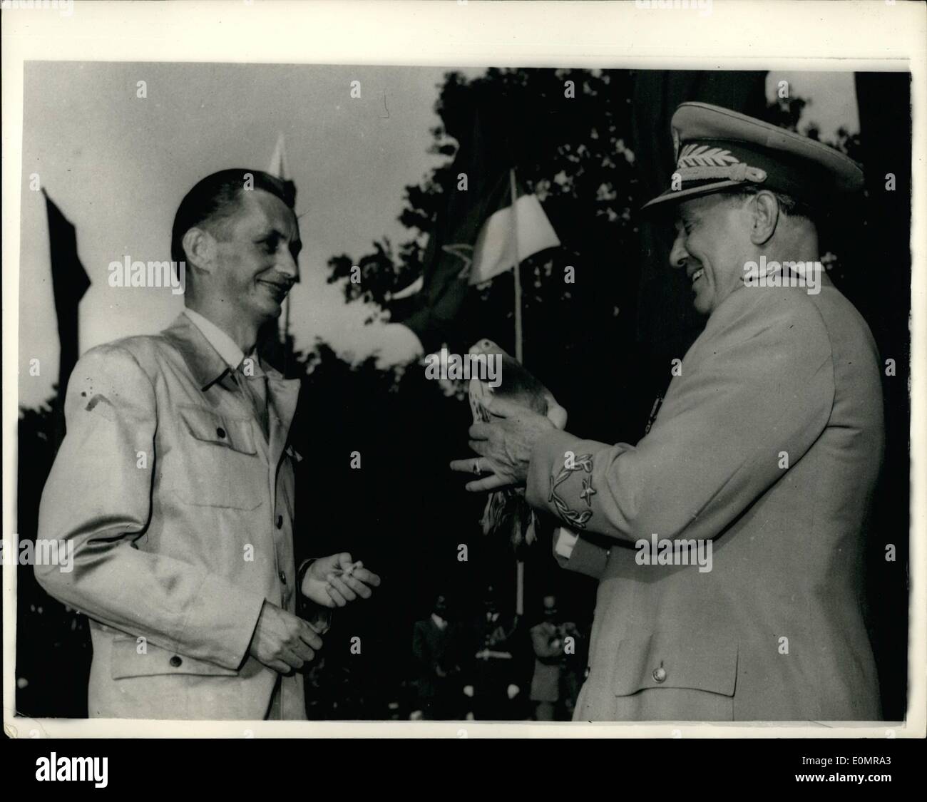 May 05, 1956 - President Tito's Birthday Celebrations: Representatives of the six Federal Republics of Yugoslavia and the Army presented their congratulations to President Tito on the occasion of his 64th birthday during the celebrations in Belgrade. Photo shows President Tito is presented with a carrier pigeon presented to him by Jugoslav postal workers to mark his 64th birthday. Stock Photo