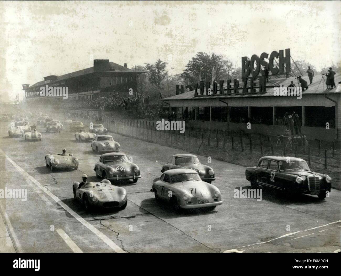 May 27, 1956 - This is a picture for sports car enthusiasts! Pictured here are 57 sports and racing cars as they begin the 1,000km race at Nuerburgring in Germany. Stock Photo