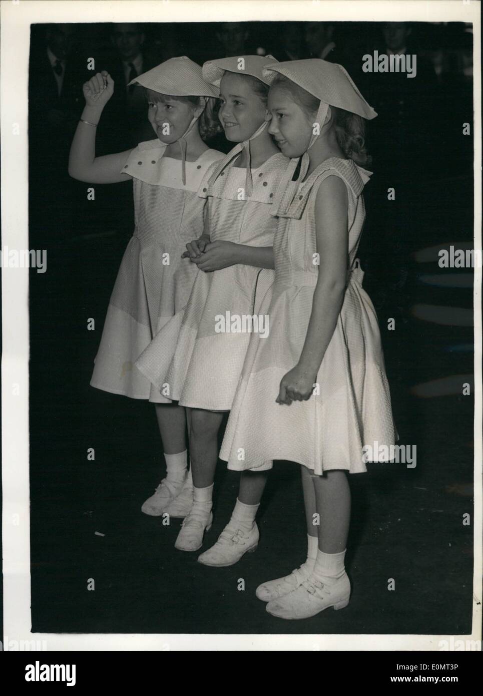 Jun. 06, 1956 - Three young sisters ate charming fashion note at Waterloo Station.: Tehse three young ladies - the sisters Yv Stock Photo