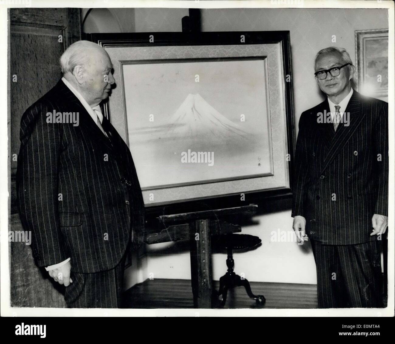 Aug. 11, 1956 - Sir Winston Churchill Receives a Japanese painting from Ambassador. Sir Winston Churchill admires a Japanese painting of Mount Fuji-Yama after it had been presented to him by Mr. Haruhiko Nishi (right) at his home at Chartwell, westerham, Kent yesterday. Mr. Nishi is the Japanese Ambassador to London Stock Photo