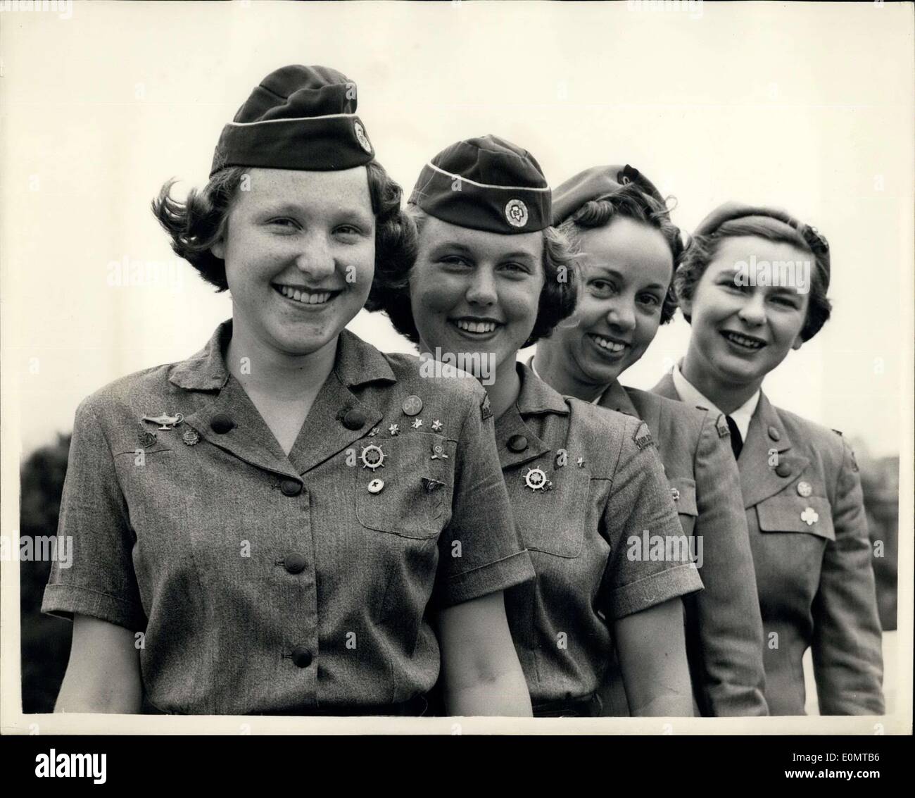 Aug. 17, 1956 - American Girl Scouts In London: Four members of the Girl Scouts of the United States of America who have been taking part in Girl Guide activities in different pats of the country for the past two months-are spending the exchange visit-their expenses having been from the Juliette Low Fund-contributed to by all members of the U.S.A Girl Guides. Photo shows The four girls at the London Guide Headquarters this morning. They are in L-R-Gail Graham (17) of Rhede Island: Nancy Sears (18) from California; Mrs Stock Photo