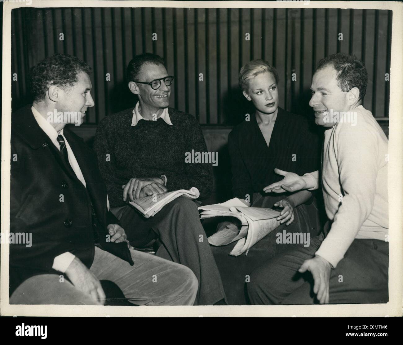 Sep. 09, 1956 - Arthur Miller attends rehearsal of his play a view from the bridge: Arthur Miller, the husband of Marilyn Monroe, today attended rehearsals of his play A view from the Bridge, which the New Watergate Theatre Club will present at the Comedy Theatre, opening on October 11th. Photo shows at today's rehearsal ( L to R); Anthony Quayle; Arthur Miller, Mary Ure and Peter Brook, the producer discussing the scripts. Stock Photo
