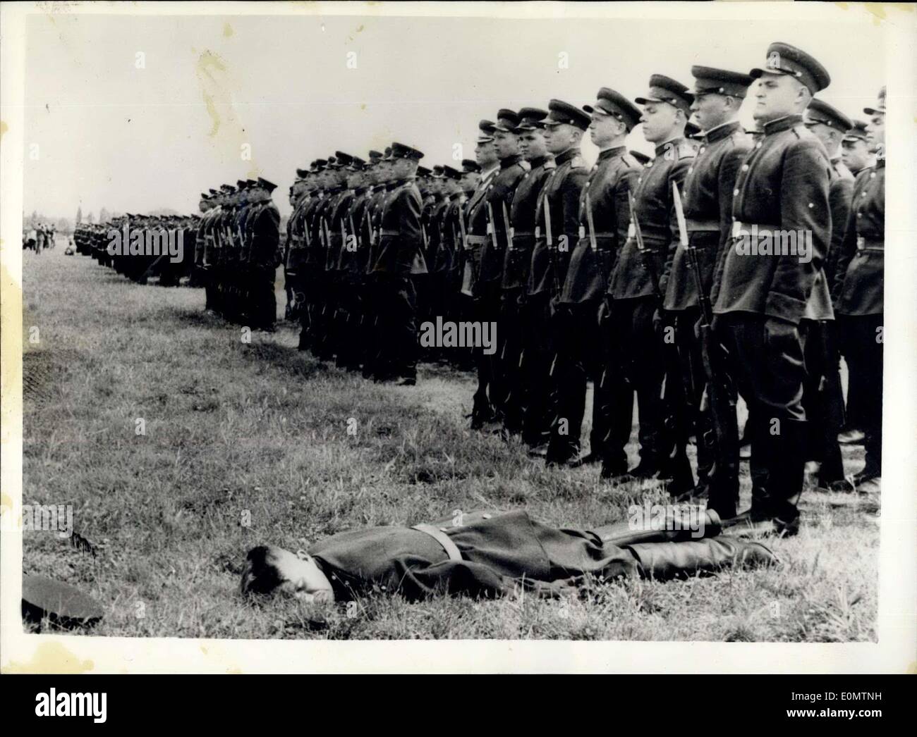 Jun. 21, 1956 - Even the Soviet Troops Do Paint - Sometimes! Russian forces leave east Germany for Home.: The first Soviet Forces - members of the 200th. Air Force Division - left the East Zonal airport at Brandenburg yesterday for home. Photo shows A Russian soldier faints during the ceremonies at Brandenburg - before they boarded the aircraft for home, yesterday. Stock Photo